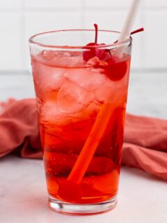 shirley temple in glass with cherry and straw