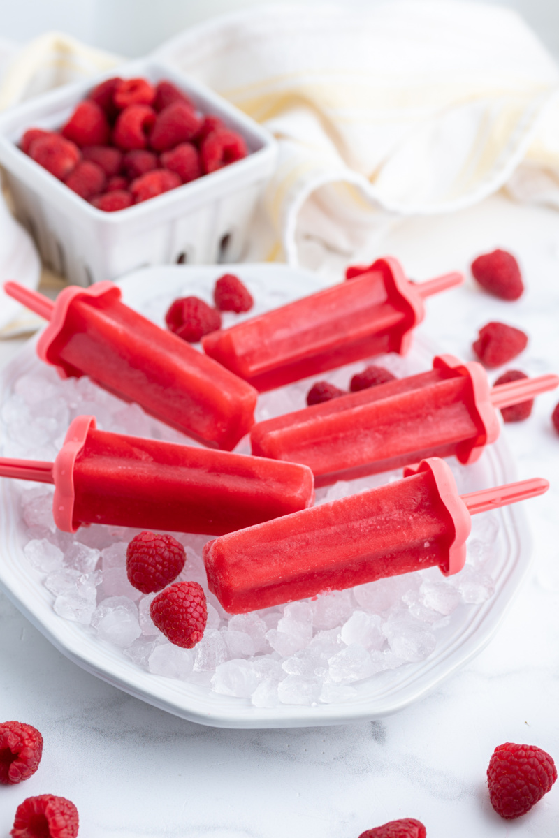 raspberry popsicles in a bowl of ice