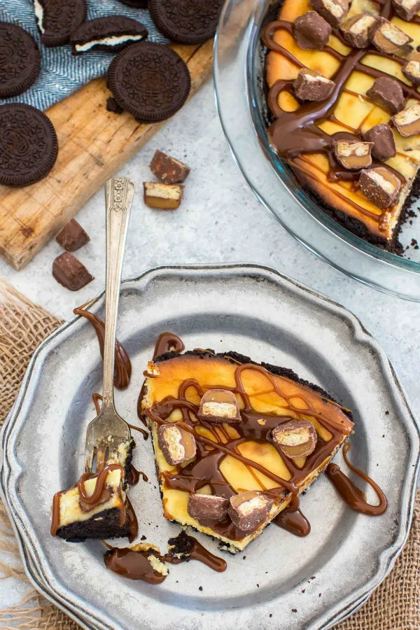 Slice of Twix Bar Cheesecake Pie