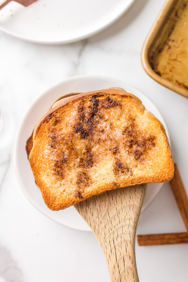 spatula picking up piece of cinnamon toast