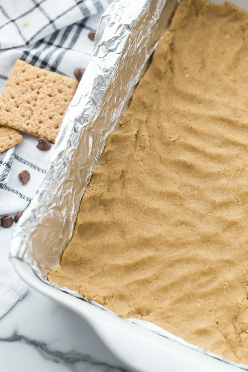 Making S'Mores Bars - graham cracker crust
