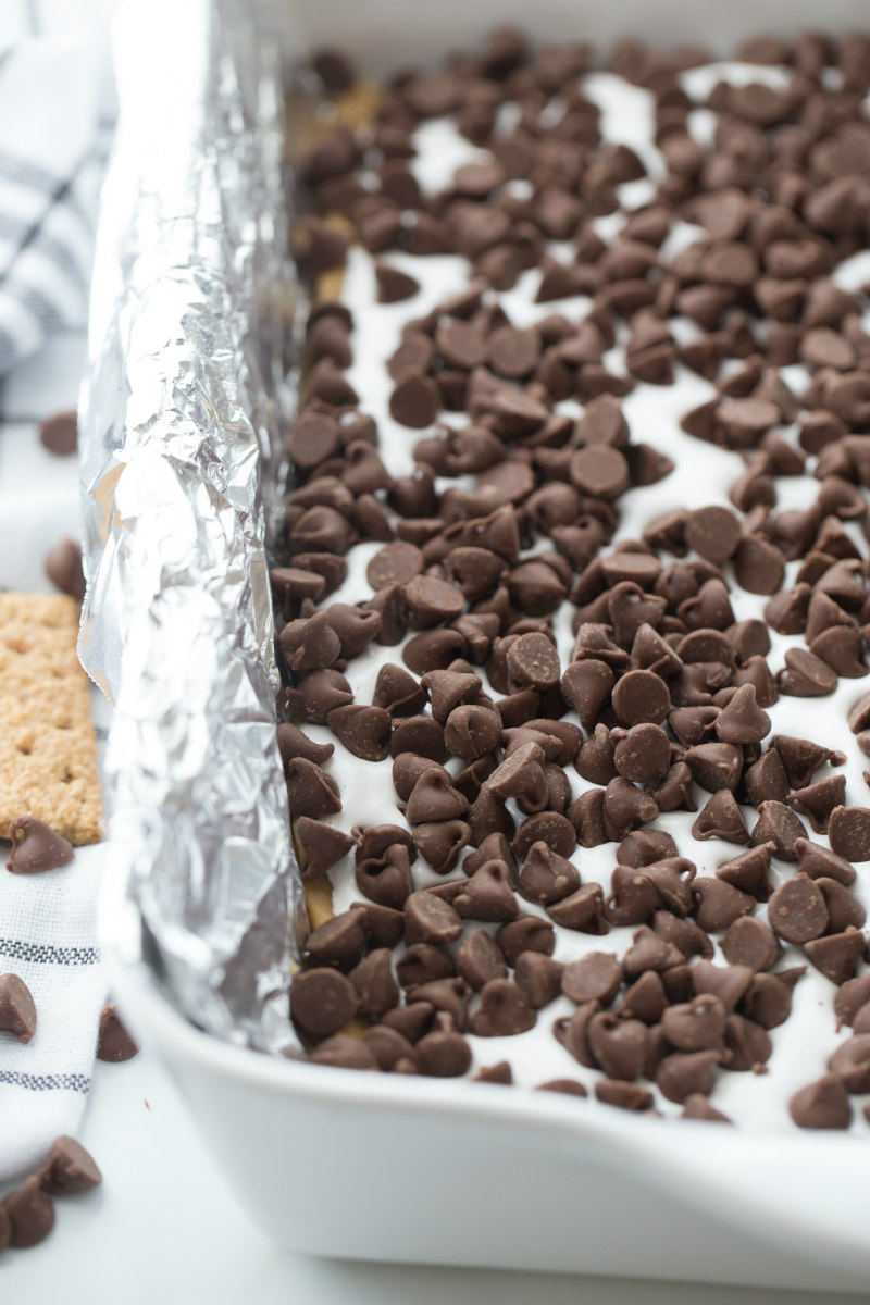 Making S'Mores Bars- adding chocolate chips