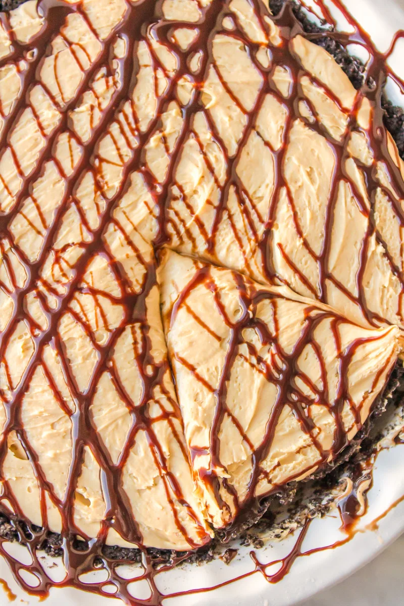 overhead shot of peanut butter pie with slice cut