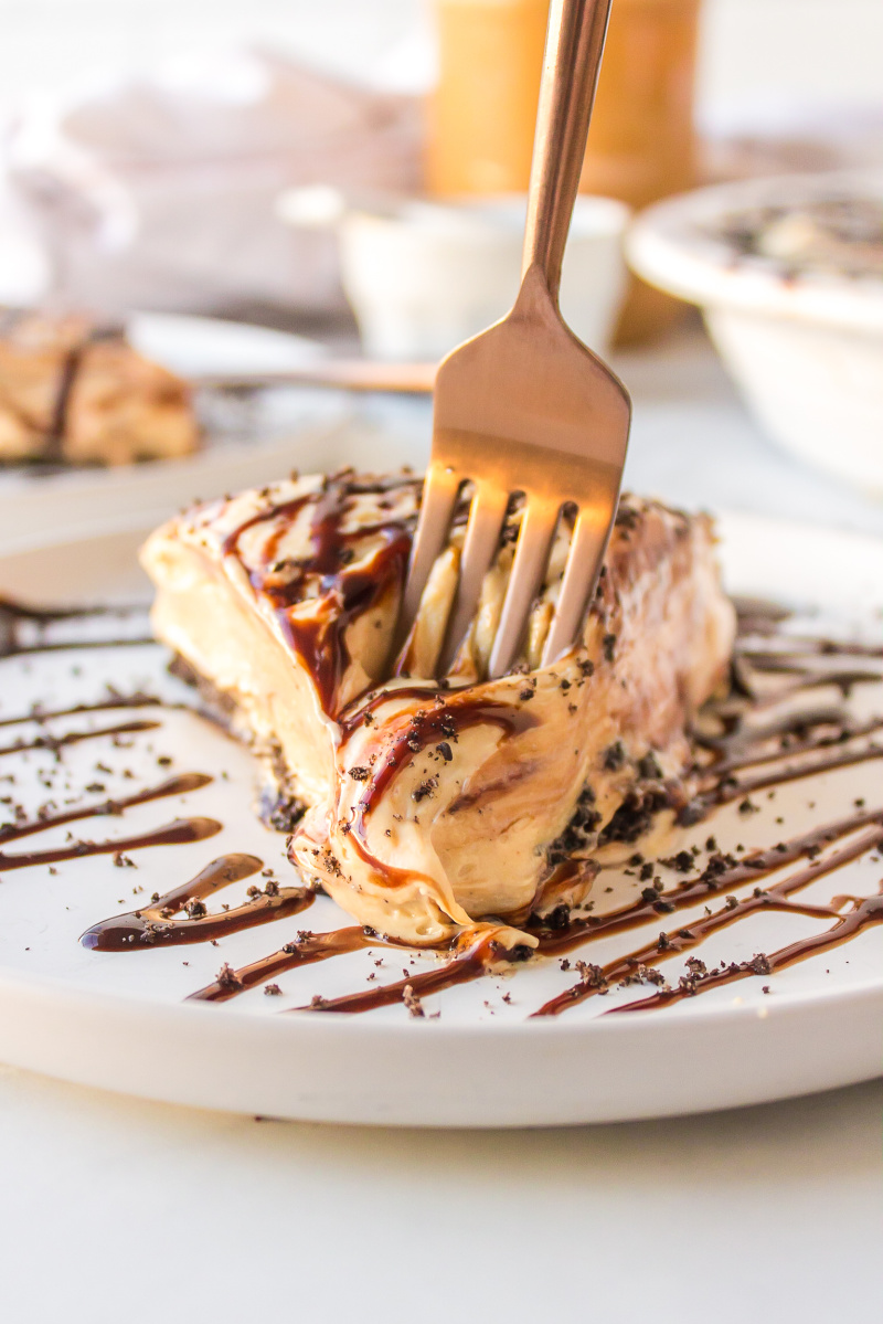 fork in slice of peanut butter pie