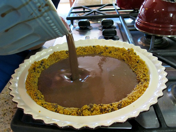 Pouring chocolate filling into pie crust