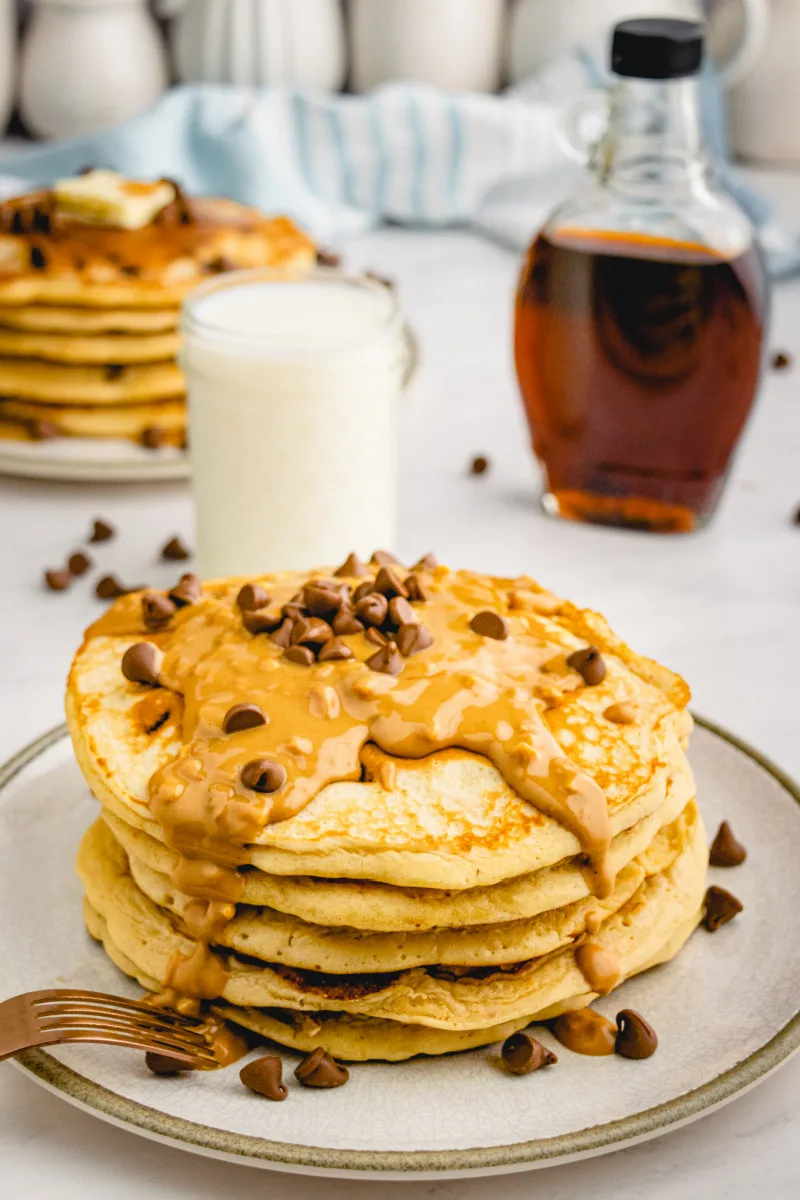 stack of pancakes with peanut butter and chocolate chips on top