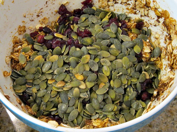 making Pumpkin Granola - pepitas added to batter