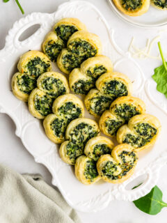 spinach palmiers on a white platter