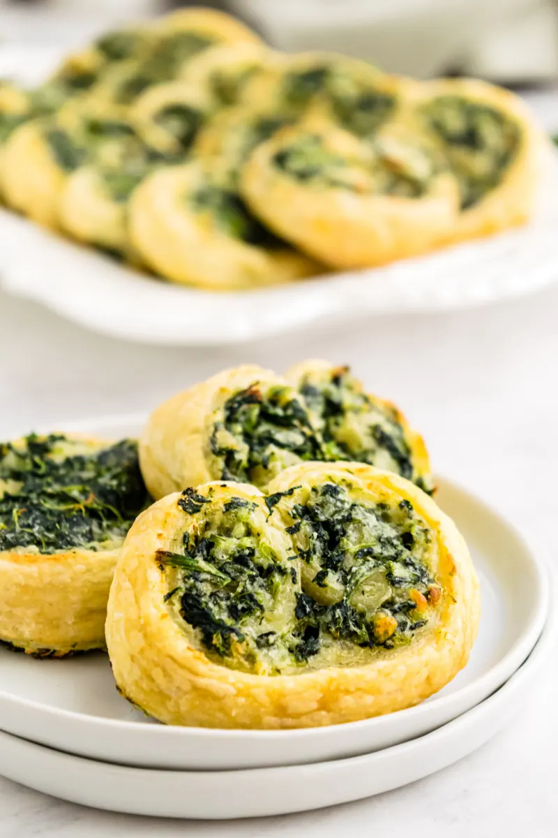 serving of spinach palmiers on a white plate