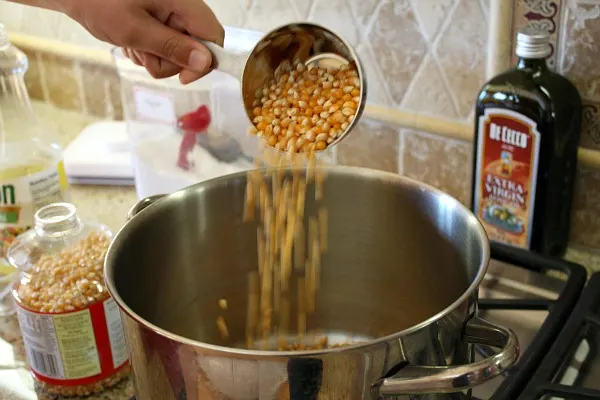 How to Make Kettle Corn : add corn to a pot 