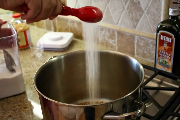 How to Make Kettle Corn : add sugar to the pot