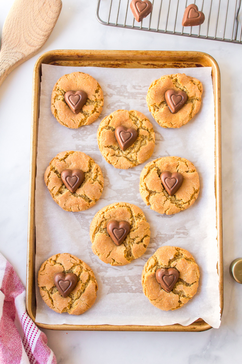 chocolate heart peanut butter cookies on a baking sheet