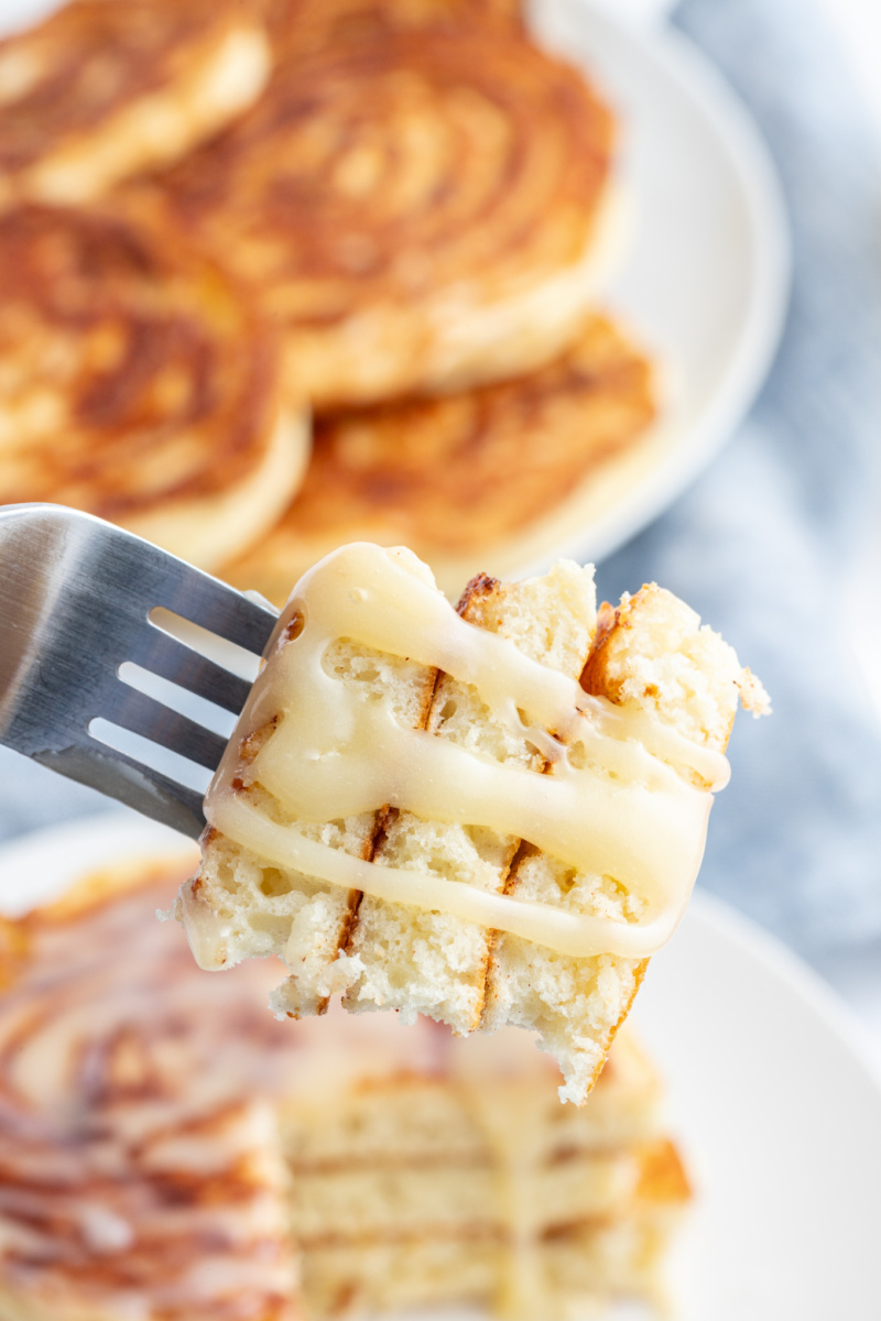 fork full of maple cinnamon roll pancakes