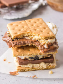 two cookie dough s'mores stacked with bite taken out of one