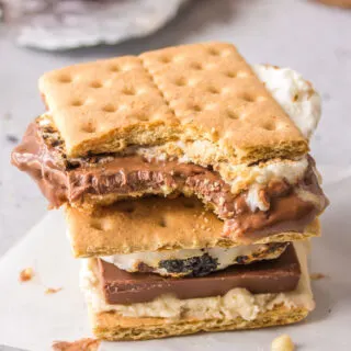 two cookie dough s'mores stacked with bite taken out of one
