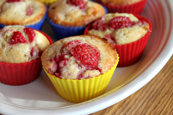 raspberry muffins on a white plate