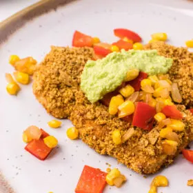 tortilla crusted turkey cutlets on plate