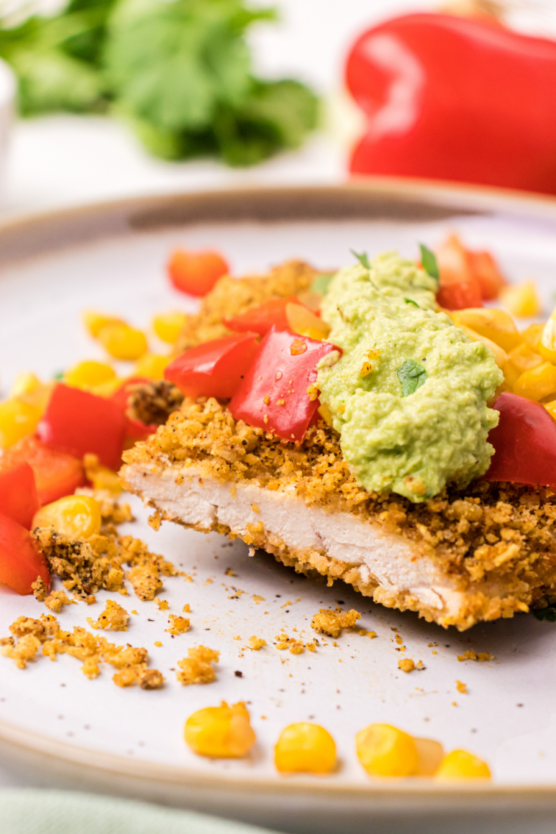 tortilla turkey cutlet topped with salsa and avocado