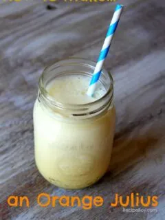 jar of orange julius with a blue and white paper straw