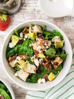 white bowl of the best spinach salad