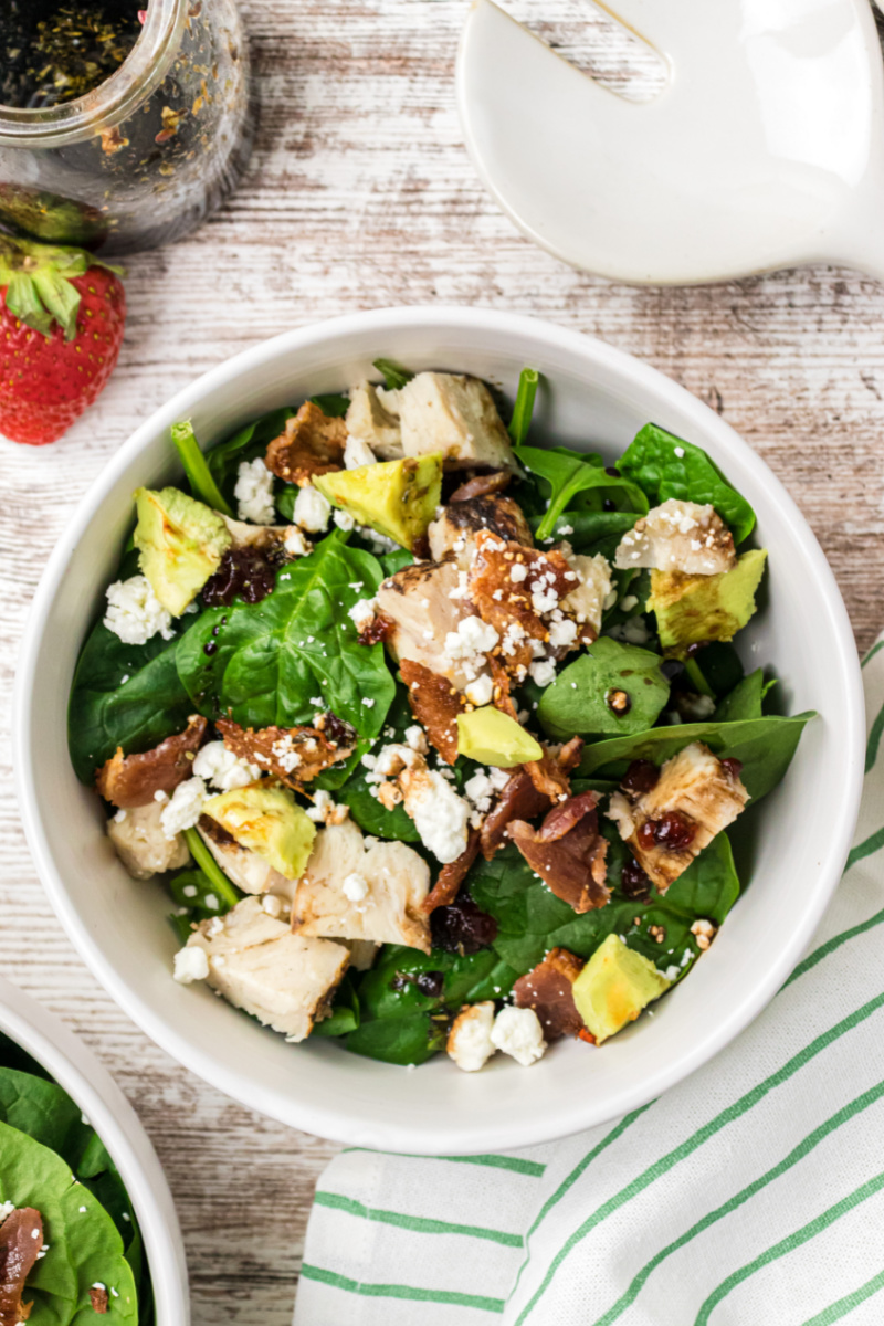 white bowl of the best spinach salad