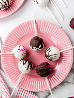 red velvet cake pops displayed on pink plate