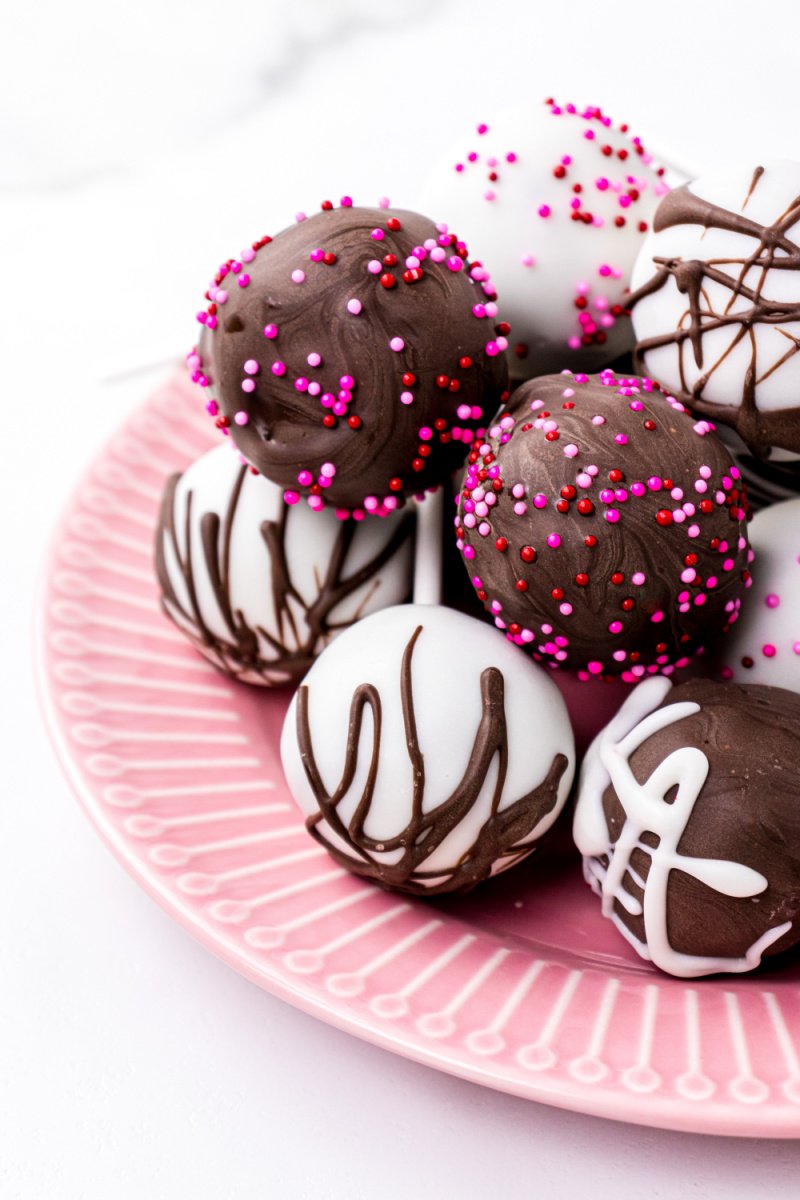 cake pops on a pink plate