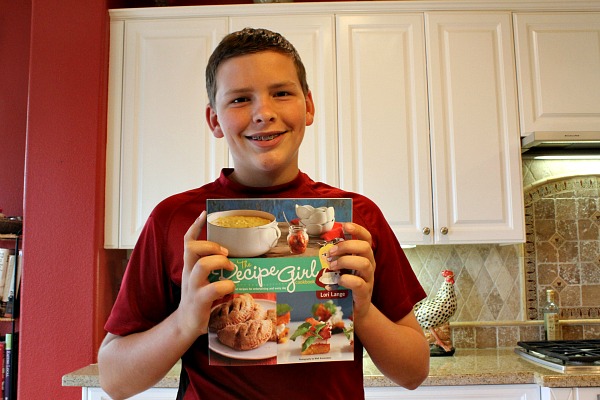 Recipeboy holding the Recipe Boy Cookbook