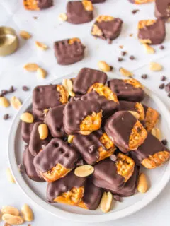 chocolate covered peanut butter pretzels on a plate