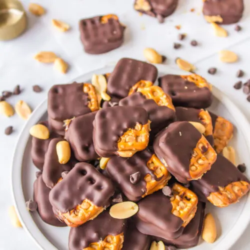 chocolate covered peanut butter pretzels on a plate