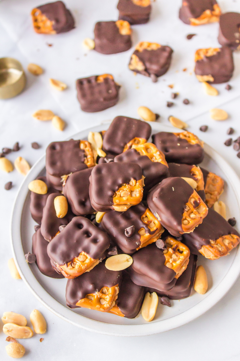 chocolate covered peanut butter pretzels on a plate