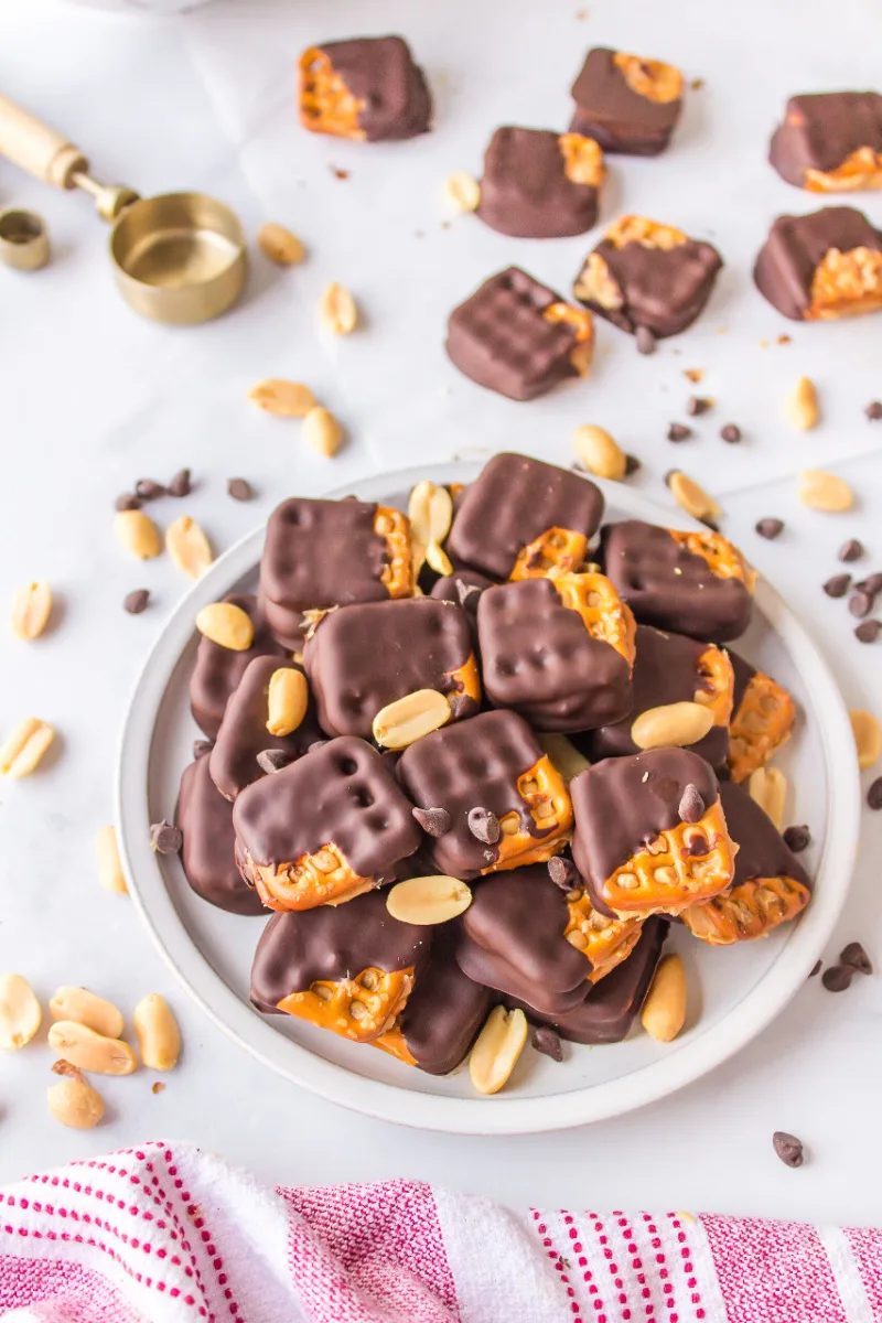 chocolate covered peanut butter pretzels on a plate