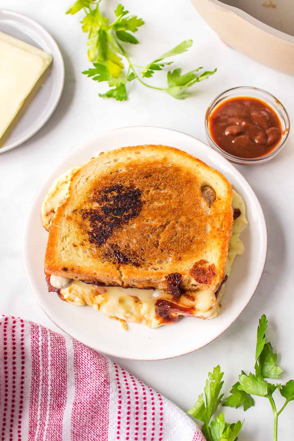 Barbecue Bacon Grilled Cheese Sandwich recipe from RecipeBoy.com : barbecue grilled cheese : bacon grilled cheese : BBQ Grilled Cheese overhead look of barbecue bacon grilled cheese on plate