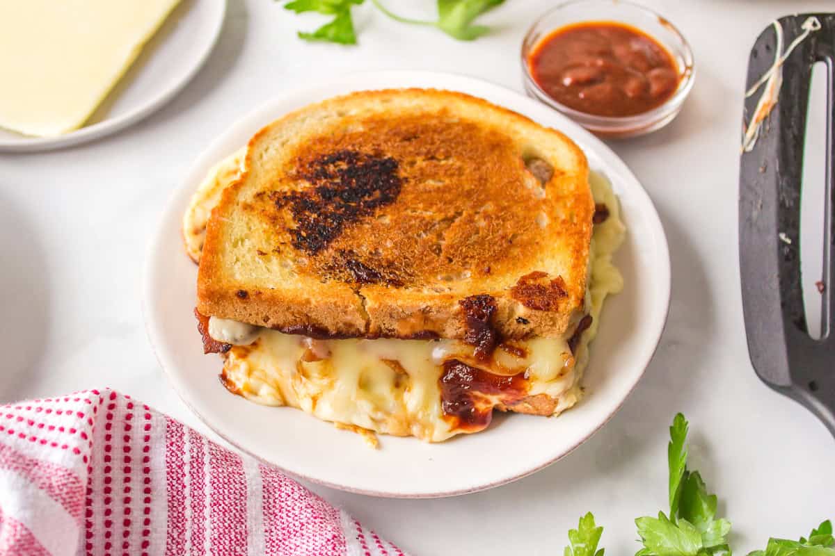 Barbecue Bacon Grilled Cheese Sandwich recipe from RecipeBoy.com : barbecue grilled cheese : bacon grilled cheese : BBQ Grilled Cheese barbecue bacon grilled cheese on plate