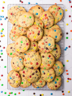 Mini chocolate M&M Cookies on a cooling rack