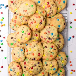 Mini chocolate M&M Cookies on a cooling rack