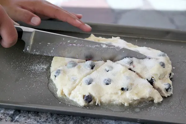 Cape Cod Blueberry Scones cutting into pieces