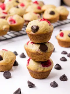 three raspberry dark chocolate banana bread muffins stacked