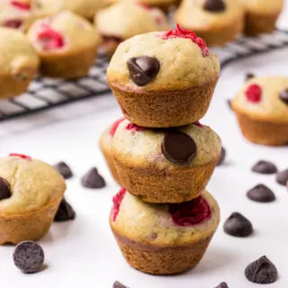 three raspberry dark chocolate banana bread muffins stacked