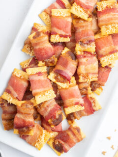 bacon crackers on a white platter