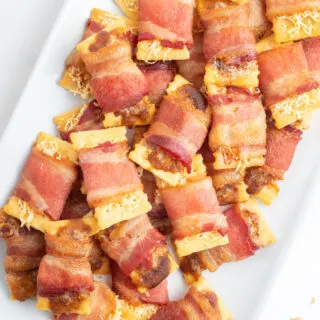 bacon crackers on a white platter