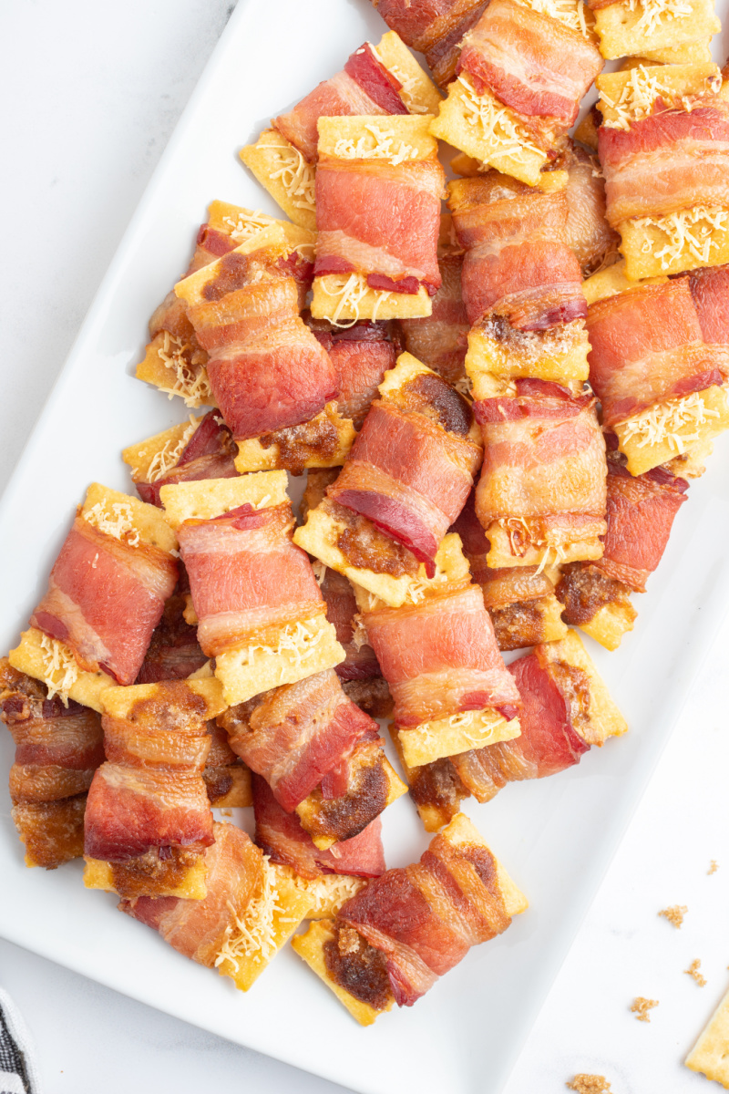 bacon crackers on a white platter