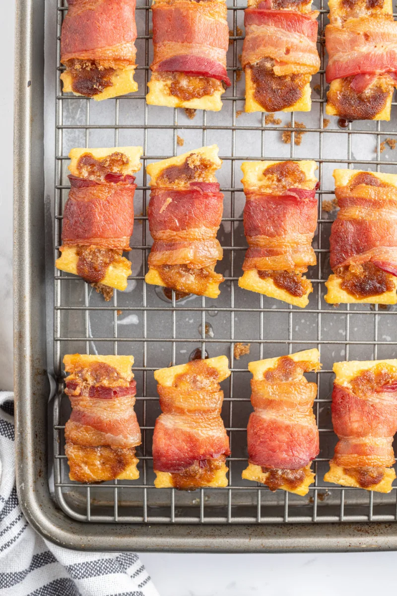 bacon crackers just out of the oven on a baking sheet