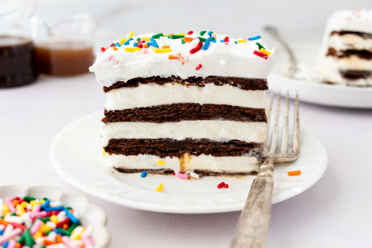15 Minute Easy Ice Cream Cake recipe using ice cream sandwiches! recipe from RecipeBoy.com slice of ice cream sandwich cake on plate with fork