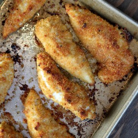 baked parmesan chicken tenders on a baking sheet