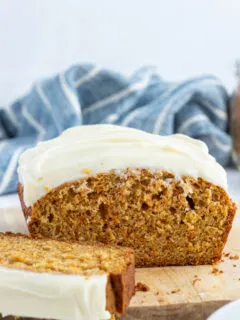 carrot loaf cake with frosting cut open