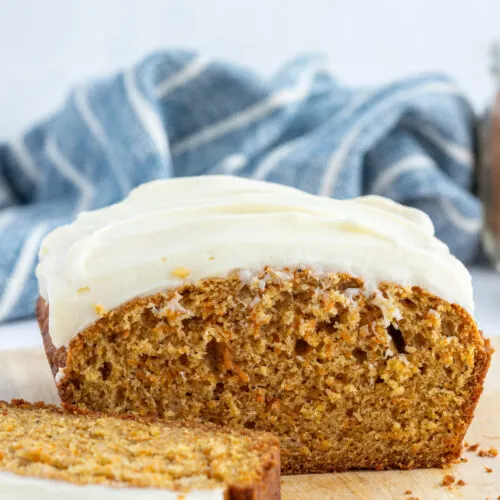 carrot loaf cake with frosting cut open