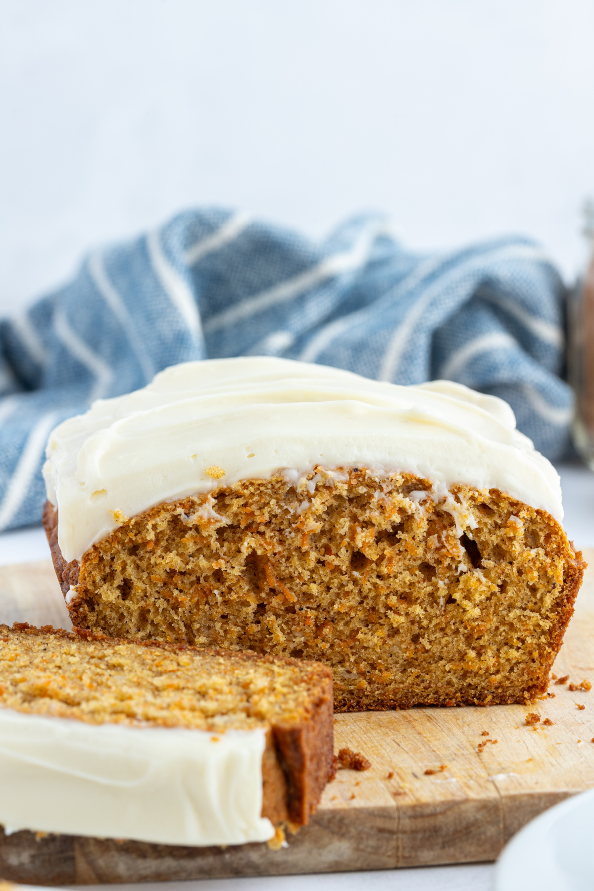 carrot loaf cake with frosting cut open