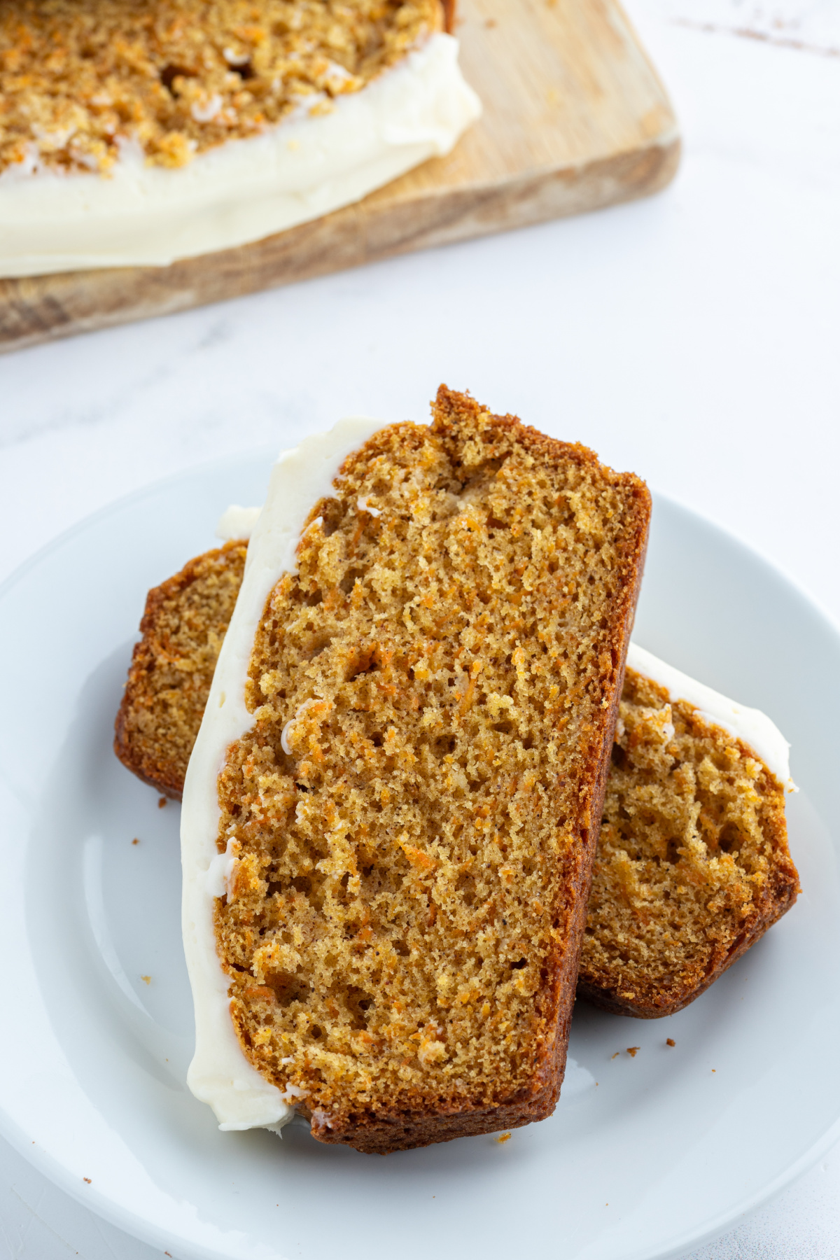 slices of carrot loaf cake on plate