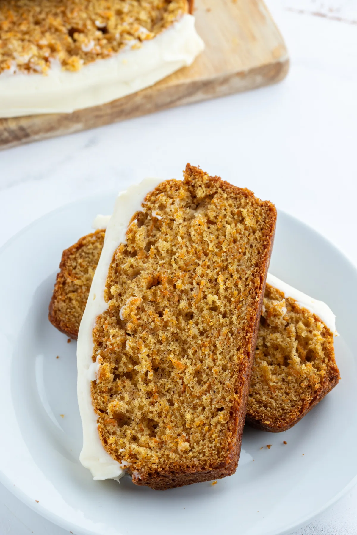 slices of carrot loaf cake on plate